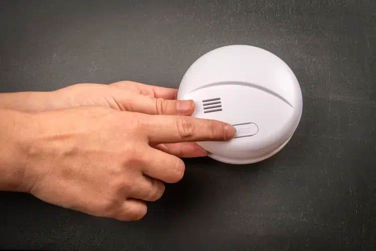 Why does a hard-wired smoke alarm chirp?